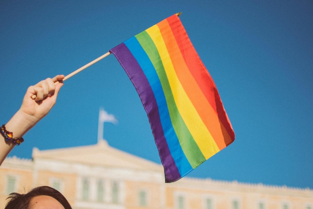 People holding rainbow flag in Lisbon, Portugal